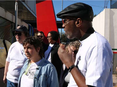 The Rev. Dr. J. Herbert Nelson, II, Stated Clerk of the General Assembly, right, and Valerie Young, left, with Synod of the Sun, listen as families share their stories at the Mexico border. (Photo by Rick Jones)