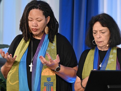 Co-Moderators of the Assembly The Rev. Shavon Starling-Louis and The Rev. Ruth Santana-Grace offered a prayer. (Photo by Rich Copley)
