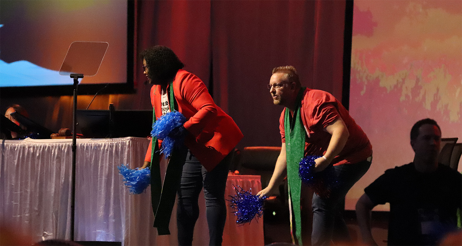The Co-Moderators of the 226th General Assembly, the Rev. CeCe Armstrong and the Rev. Tony Larson toss pom poms into the crowd at the conclusion of the final plenary.