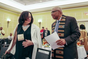 Rev. Dr. Thomas H. Priest Jr and Stefanie Lewis talking before opening ceremonies of the National Black Presbyterian Caucus dinner.