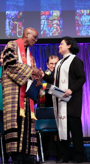 Stated Clerk J. Herbert Nelson, II passes the peace with The Rev. Najla Kassab, President of the World Communion of Reformed Churches, at Wednesday's Ecumenical Service of Worship.