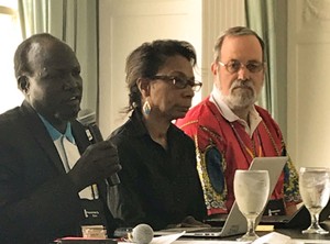 The Rev. John Yor (left) speaks to the World Mission luncheon at the 223rd General Assembly. 