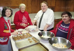 From left to right baking cookies at the Colby church: Regena Barnum, Merna Schroeder, Andy Sonneborn, Veronica Roopchan.  
