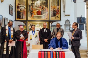 WCRC General Secretary Chris Ferguson signs the historic document pledging to heal divisions in Christendom brought on by the Protestant Reformation.