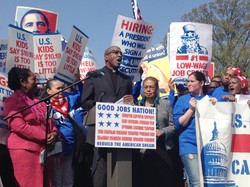 Rev. J. Herbert Nelson speaks at a news conference with striking federal contract workers in Washington, urging the president to raise wages to $15 an hour. 