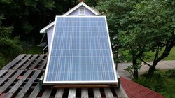 Noah Wilding uses this solar panel to power his lawn care equipment.