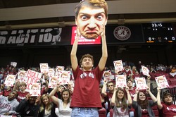 Jack Blankenship holds up a poster of his face. 