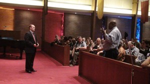 Rev. Dr. Mulumba of the Presbyterian Community in Congo addresses U.S. Sen. Chris Coons at the final event of the Congo Mission Network meeting at First Presbyterian Church in Newark, Del.