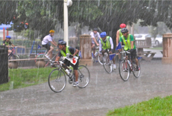 Cyclists riding in the rain.