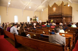 Church members sitting in the sanctuary of First Presbyterian Church in Watervliet, N.Y.
