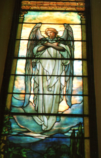 A stained glass image of an angel.