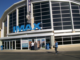 The front entrance of a movie theater with the words "IMAX" in blue.