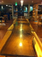 A long wooden table in a room.