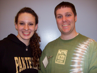 Photo of a young woman wearing a "Pathways" sweatshirt and a man