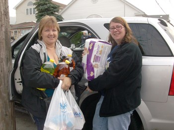 Karen and Ann Mohr, former residents of Breezy Point, returned “home” to bring relief supplies to stricken neighbors.