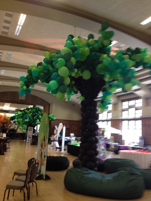 Balloon trees transform the PYT exhibit hall into a treehouse.