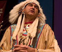A man in Lakota/Sioux traditional dress.