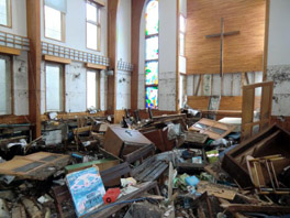 The interior of a church, with things destroyed by an earthquake.