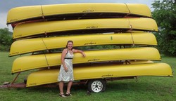 Bri Payne, with a trailer-full of canoes.