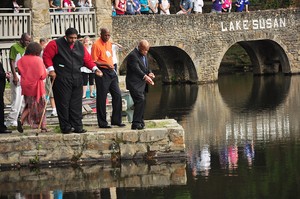 U.S. Representative John Lewis is joined by J. Herbert Nelson of the PC(USA) Office of Public Witness and William Barber II, president of the North Carolina NAACP, as they scatter flower pedals at Montreat in honor of civil rights leader Julian Bond who died last week.