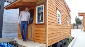 Pastor Mark Zimmerly of Madrona Grace Presbyterian Church in Seattle exits the tiny house being constructed that will reside on church property.