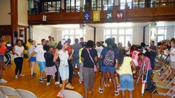 Freedom School children begin their day with motivational song and Harambee celebration.