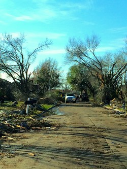 A neighborhood street in Rowlett, Texas, heavily damaged by an EF3 tornado. As many as 446 homes were damaged and 23 people were injured.