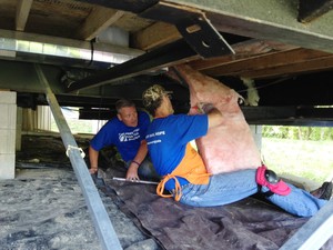 Pennsylvania volunteers repair a home damaged by spring flooding in West Virginia.