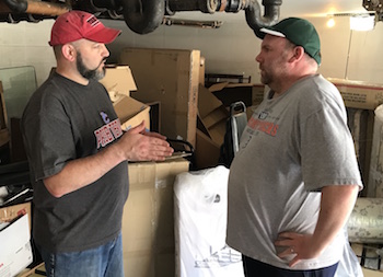 Andrew Yeager-Buckley, manager of the “Hands and Feet” initiative, discusses the program with Neil Myer, director of UKirk at Michigan State University.