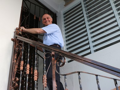 Rev. Jim Kirk, PDA associate for domestic disaster response, opens the door to Angels’ Lodge, a new volunteer village at the Presbyterian Church in Ańasco