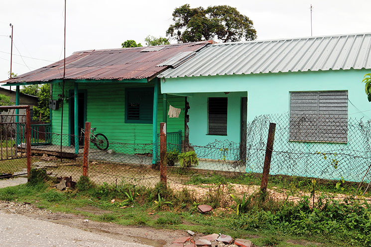 The modest home of Abel Perviez (green house on the left) serves as the sanctuary for the Jatibonico Mission.