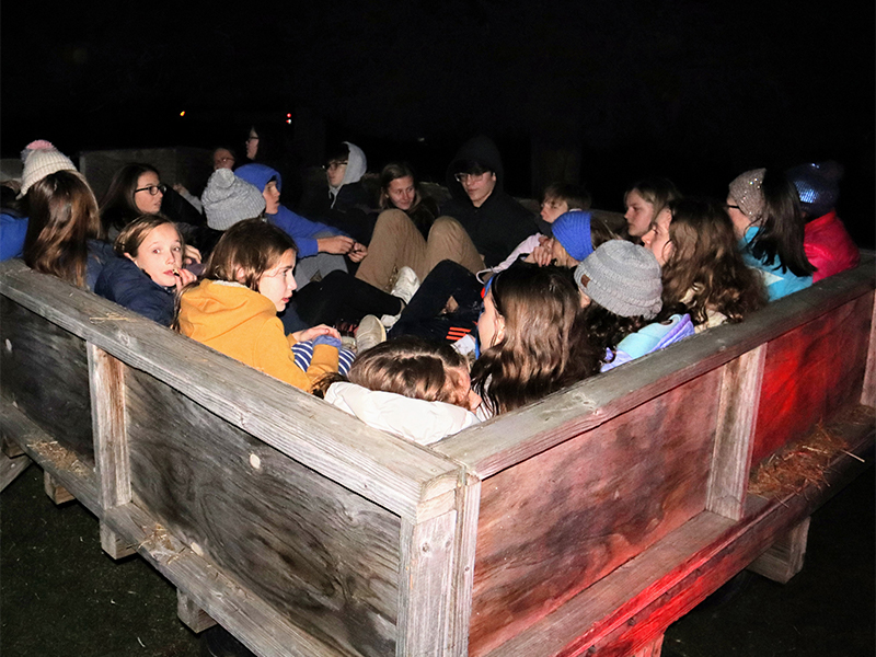 Youth pile into a wagon for a hayride at Cedar Ridge Camp outside of Louisville, Ky. Photo by Andrew Hartmans.
