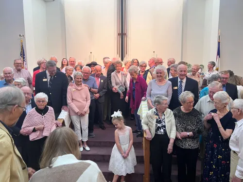 Rev. Dr. Judi McMillan & group posing for photo