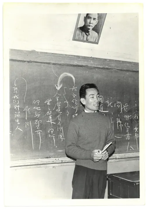 Man before blackboard
