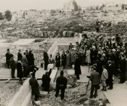 Black and white photograph of a large crowd gathered for a cornerstone-laying ceremony in Lebanon.