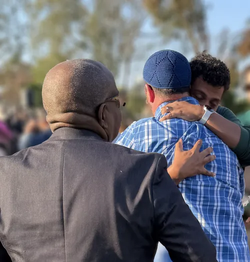 Hugs at the Interfaith Prayer Vigil at the Islamic Center of San Diego on March 19, 2026