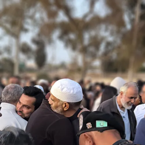 Two men embrace Interfaith Prayer Vigil at the Islamic Center of San Diego on March 19, 2026