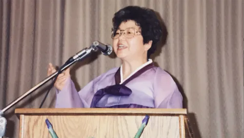Rev. Jean Kim at the pulpit of the Church of Mary Magdalene, the congregation she founded.