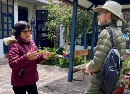 Woman and Andrew talking at the center