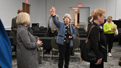 Deb Davies guides a delegation of Presbyterian Life & Witness staff & COLA members through the Baird Center while making final arrangements in May 2026. Photo by Rich Copley.