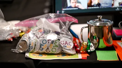 GAO buttons in plastic bag on table 