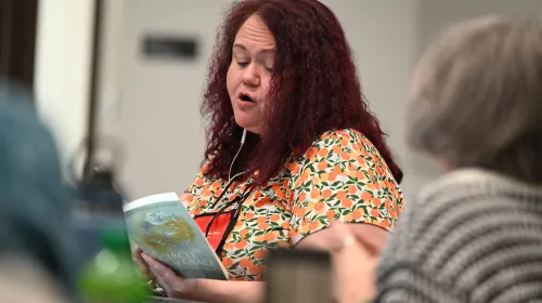 Person reads from book