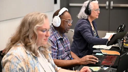GA227 Ordination Committee Leadership Team  sitting behind monitors/laptops