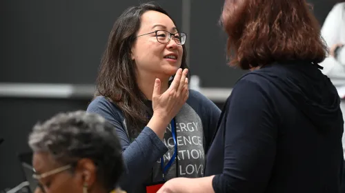 Stated Clerk of the General Assembly Jihyun Oh catches up with other meeting participants at the final gathering of the Unification Commission on June 26, 2026. Photo by Rich Copley.