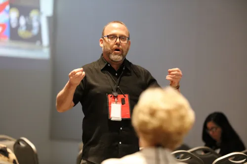 David Barnhard discusses how communities have shifted their focus from the terror and loss of gun violence to what communities are doing to prevent it. Photo by Jim Deweese. 