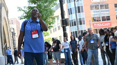 The Rev. Dr. Alonzo Johnson led prayer in front of City Hall. Photo by Rich Copley.