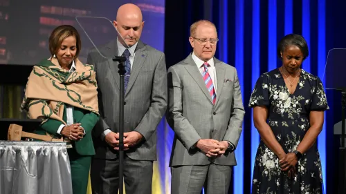 Krysten Holloway, Ian Hall, Tom Taylor, and Bridgett Green (left to right) gathered in prayer as the General Assembly elected them into leadership roles as part of the consent agenda. Photo by Rich Copley. 
