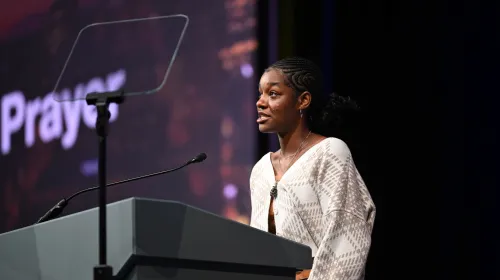 Young Adult Advisory Delegates Zaria Cuffee (left) and Katherine Barden (no pictured) led the plenary's closing prayer. Photo by Rich Copley. 