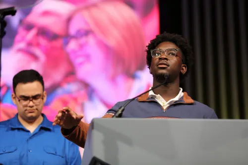 YAADs Ethan Chaparro & Michael Ofori led the assembly in prayer at the end of the 7th plenary. Photo by Jim Deweese.