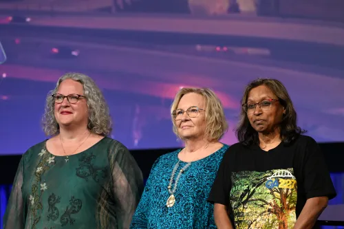 COLA Members Kim Trimboli, Cindy Stigler, and Nancy Lalla (left to right) welcome participants of the 227th General Assembly to Milwaukee. Photo by Kristen Gaydos.